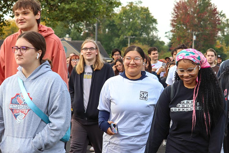 PNW students, faculty, staff and the community march at the Honors College 5k.