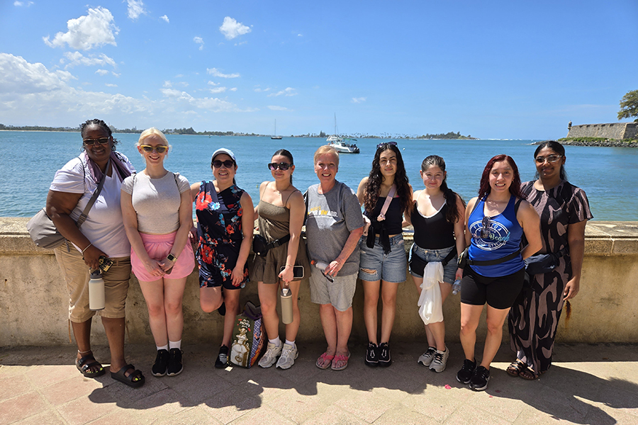 Study Away in Puerto Rico - 8 CON students standing in front of a body of water in Puerto Rico