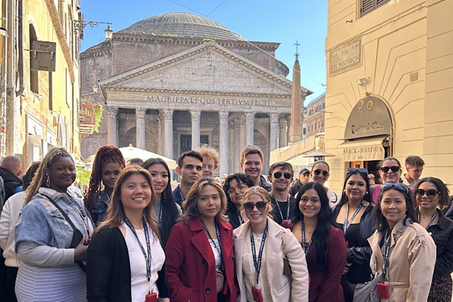 Study Away in Italy - group of HTM students standing in front of a building in Italy
