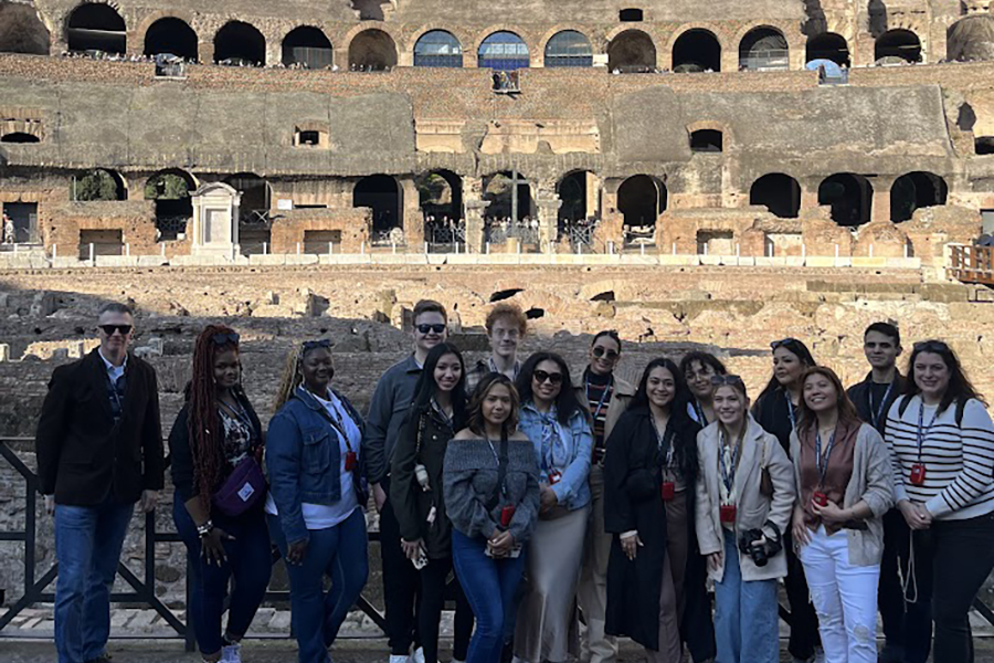 Study Away in Italy - group of HTM students standing in front of a building in Italy