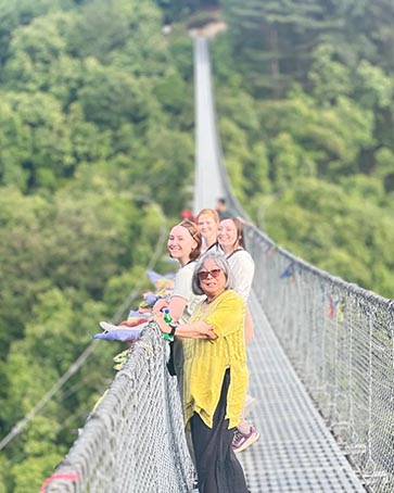 PNW students on a hanging bridge in Nepal for Study Away program.