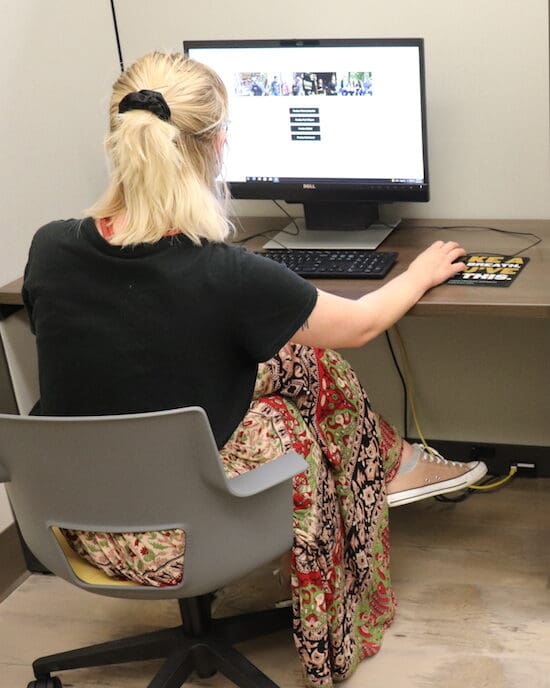 A student in the testing center is pictured.