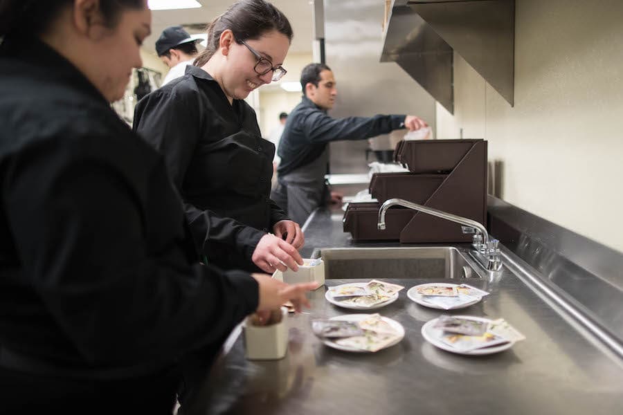 Students are prepping food.