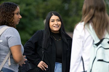 PNW students talk together on campus