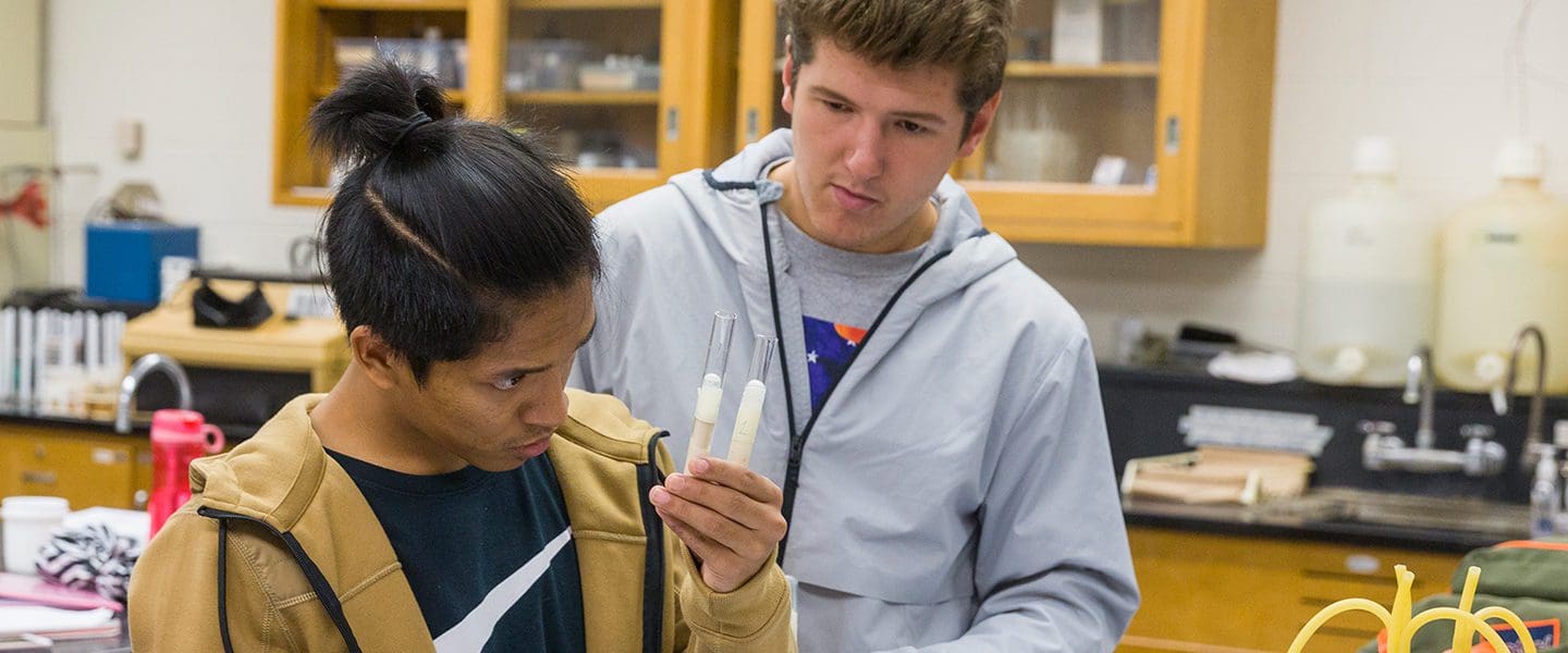 students looking at beakers