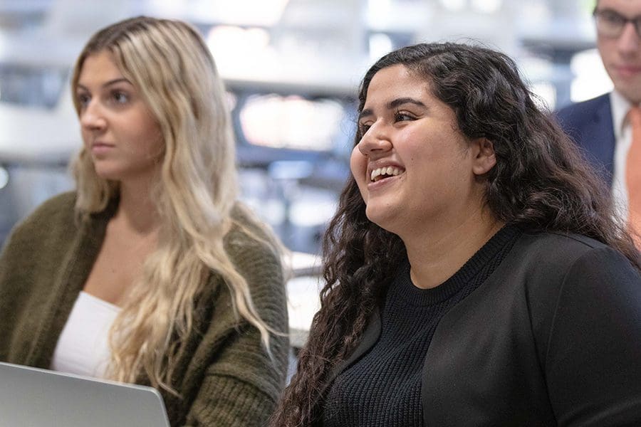 Two female students smiling