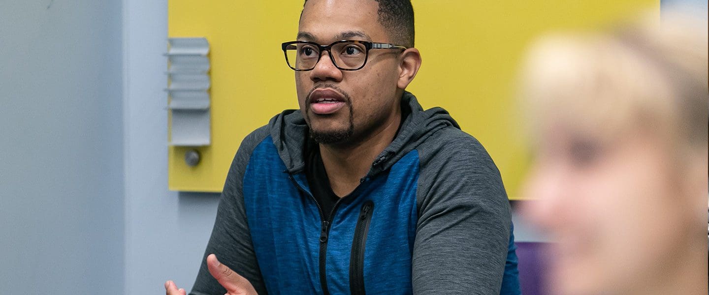 Male student speaking in class