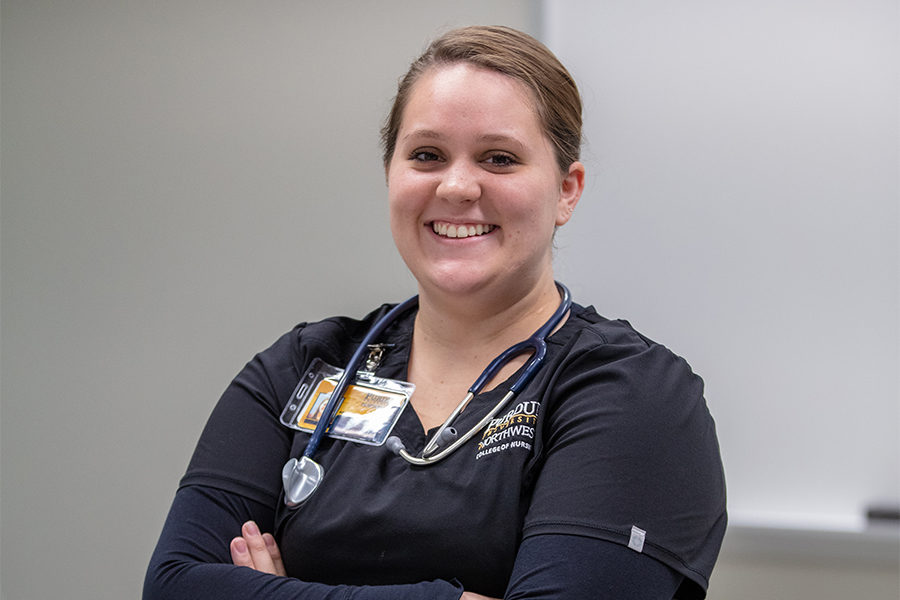 A nursing student smiles.