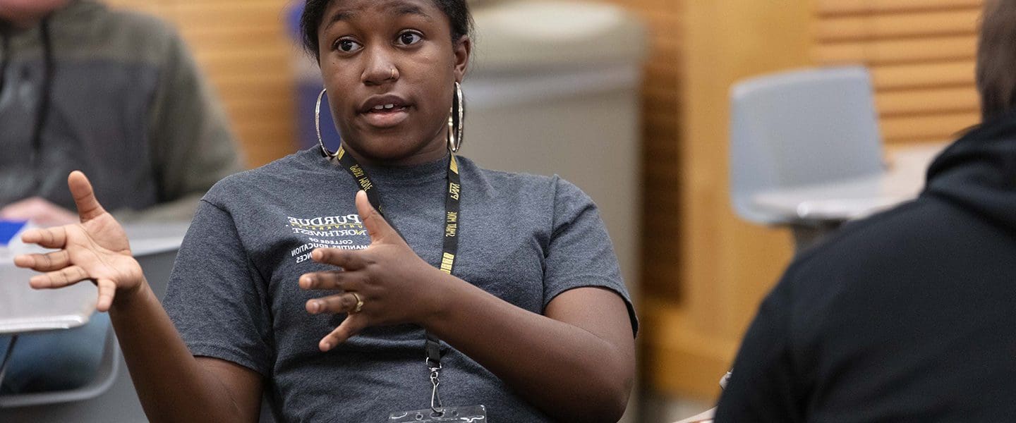 Female student speaks to class