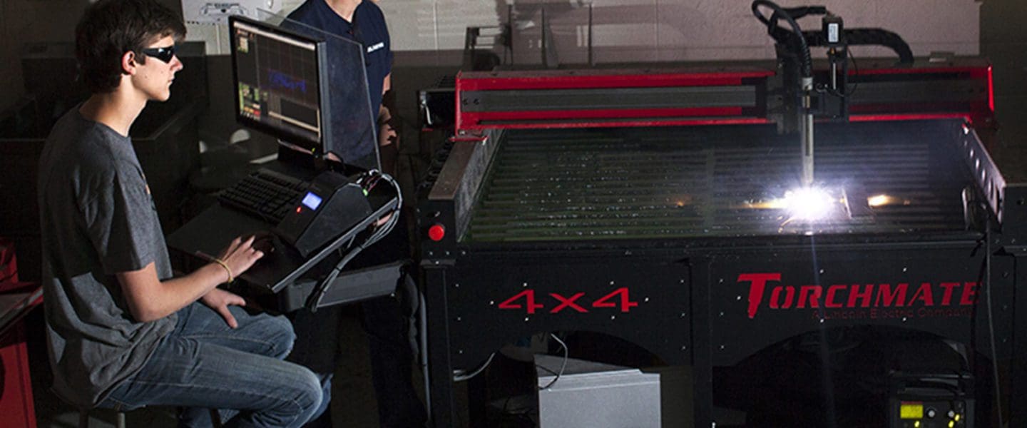 Students prepare pats using a plasma CNC torch