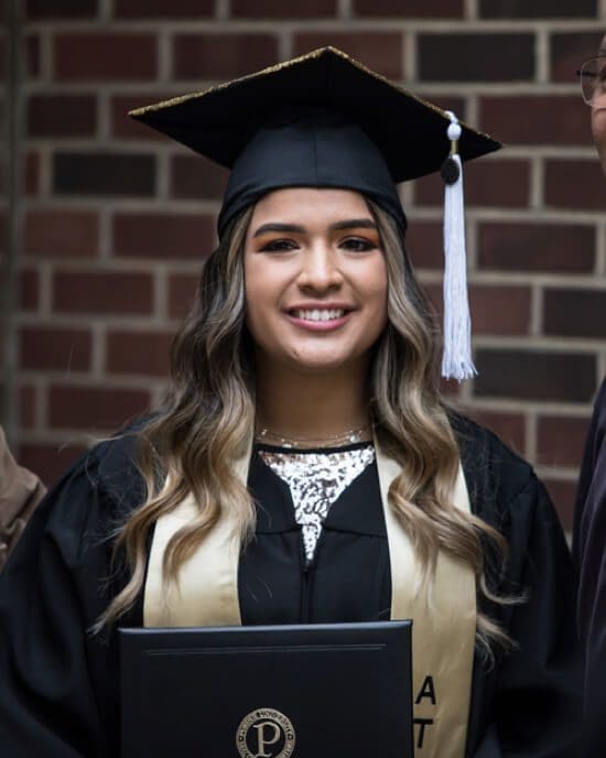 close up of grad in cap and gown