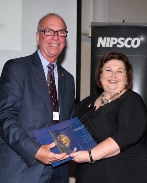 NIPSCO President Violet Sistovaris presenting the Luminary Award award to Chancellor Keon