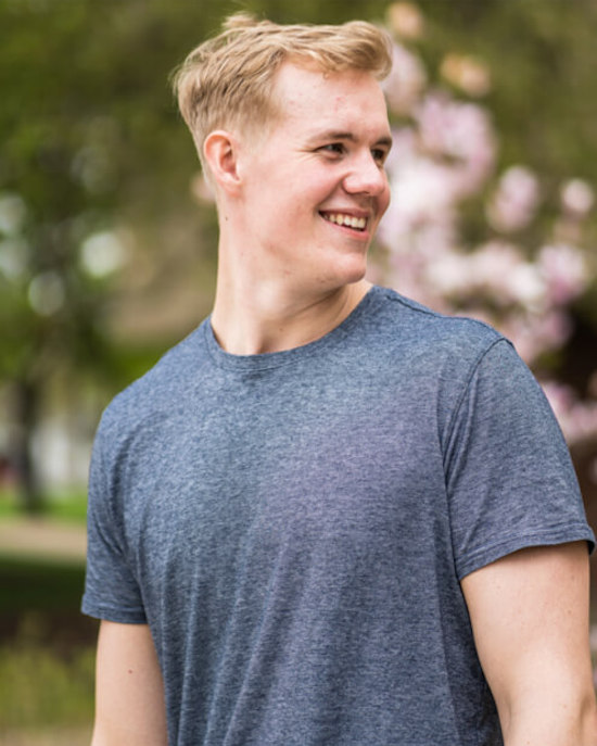 closeup of smiling student in gray shirt