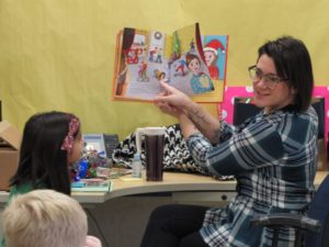 Heather Zivkovich reads her recently published Christmas book, co-authored by her late father, to a second grade class at Eisenhower Elementary in Crown Point, Indiana.