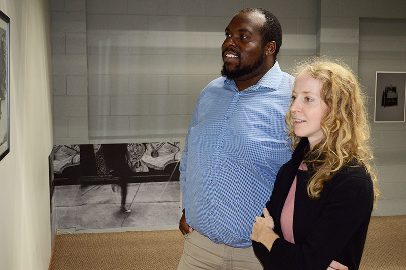 Morganne Wakefield (right) and Ryan Stephens looking at a painting