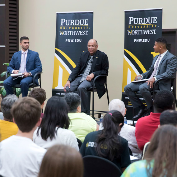 Students talk with Napoleon Brandford