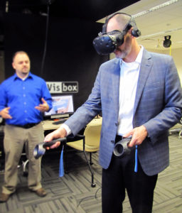 Mike Hooper, senior vice president of Electric Operations participates in an interactive training simulation