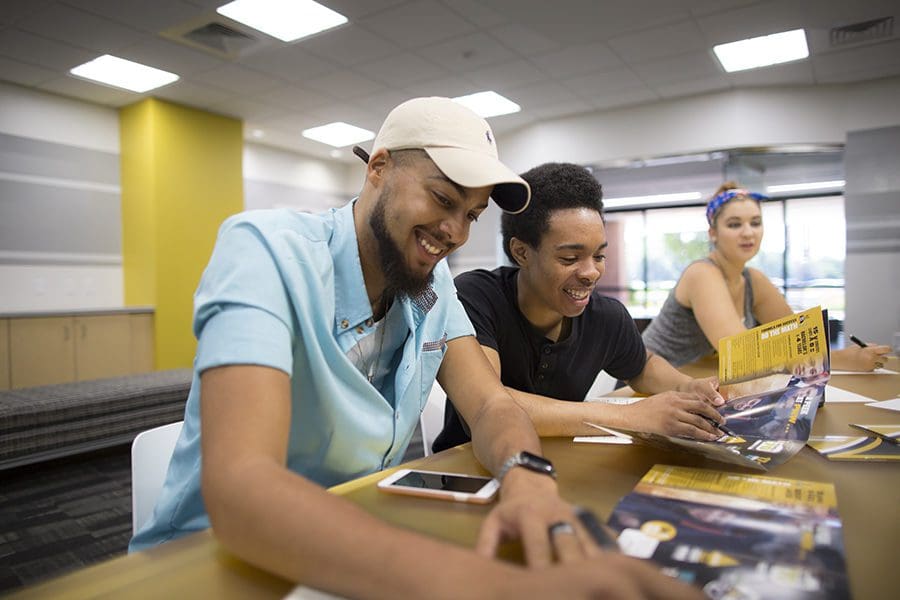 Two students work in the classroom