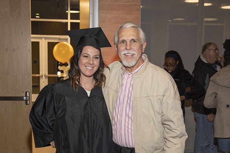 A PNW student celebrates commencement with her father.