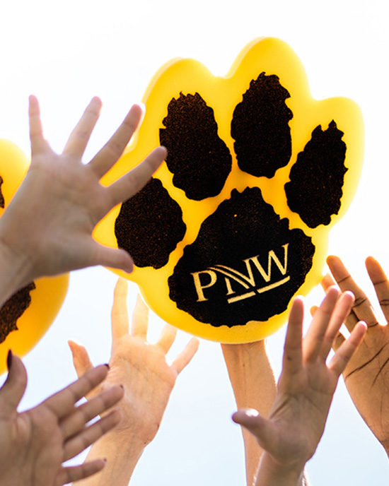 Upraised hands, including a PNW mascot paw.