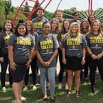 A group of Honors College students in front of a sculpture on Westville campus.