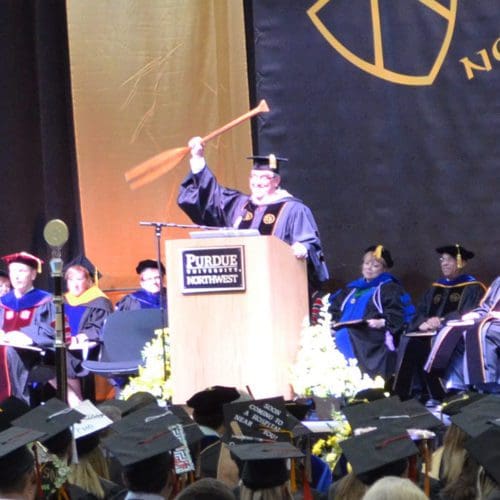 Stephen Turner, holds up a canoe paddle