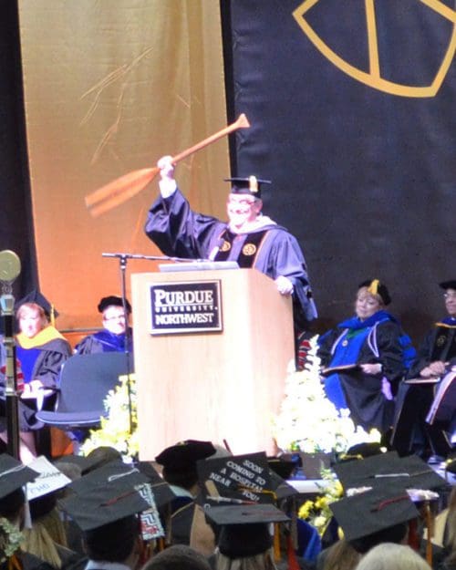 Stephen Turner, holds up a canoe paddle