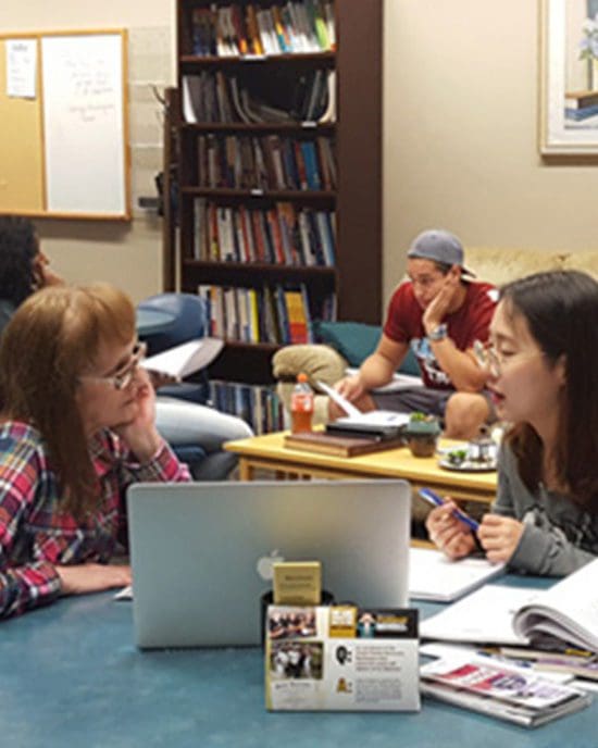 A student consults with a Writing Center instructor