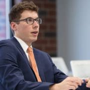 A student in a suit in the classroom