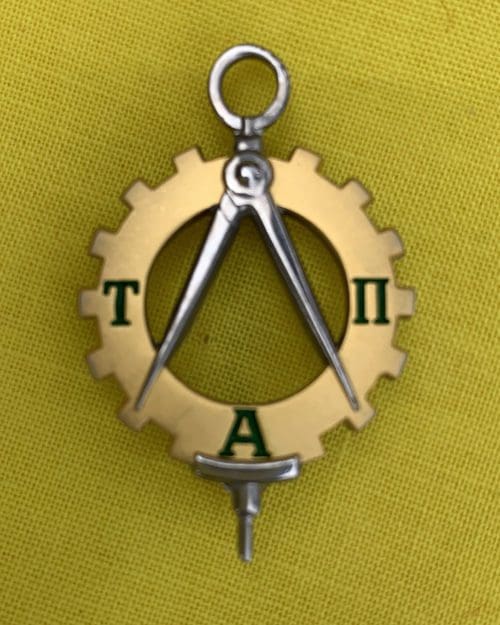 The Tau Alpha Pi pin