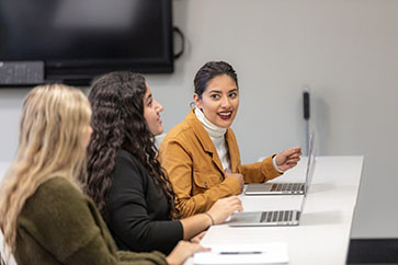 Students talk in PNW's HTM classroom