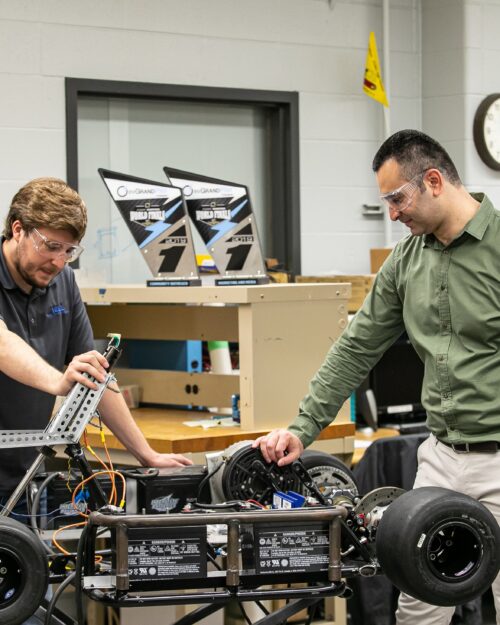 Khair Al Shamaileh, PNW assistant professor of Electrical Engineering, works with a student in an engineering lab. Fifteen PNW engineering students from East Chicago, Hammond and Whiting recently received scholarship funds from bp America, Inc.