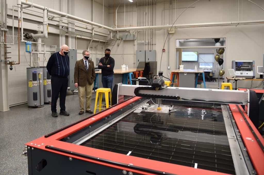 Stewart McMillan, chairman emeritus of Task Force Tips, tours the new PNW Design Studio with Dietmar Rempfer, director of the PNW School of Engineering and Marcel Mejulu, Design Studio support technician.