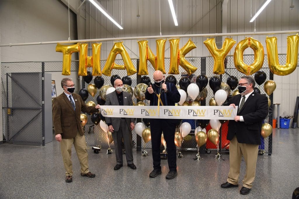 (From left): Dietmar Rempfer, director of the Purdue University Northwest (PNW) School of Engineering; PNW Chancellor Thomas L. Keon; Stewart McMillan, chairman emeritus of Task Force Tips; and Kenneth C. Holford, PNW provost and vice chancellor for Academic Affairs, cut the ribbon on the PNW Design Studio. 