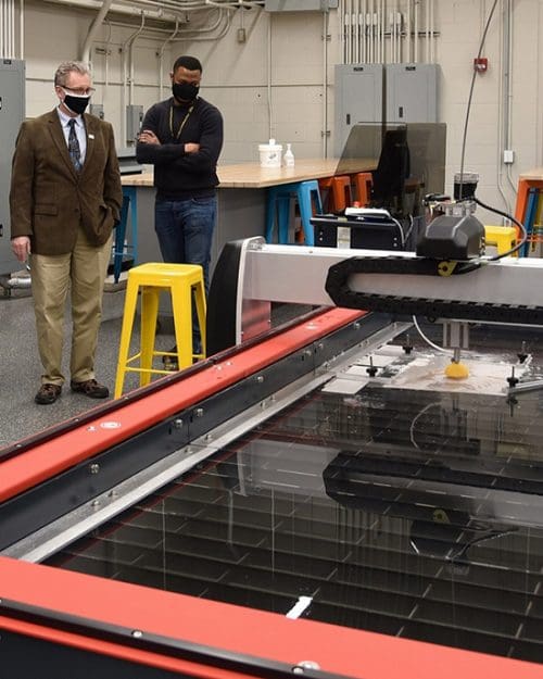 Stewart McMillan, chairman emeritus of Task Force Tips, tours the new PNW Design Studio with Dietmar Rempfer, director of the PNW School of Engineering and Marcel Mejulu, Design Studio support technician.