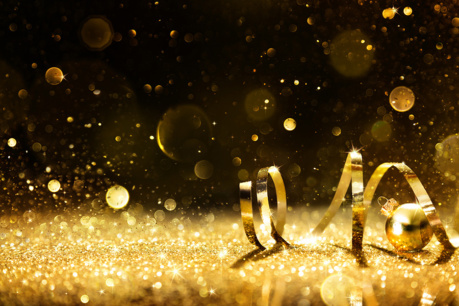 Golden ribbon on shining glitter - christmas background