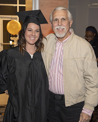 A daughter and dad at graduation