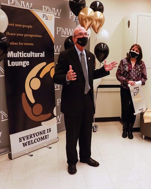 Purdue University Northwest Chancellor Thomas Keon briefly speaks at an open house for the new multicultural lounge in Classroom Office Building Room 180.