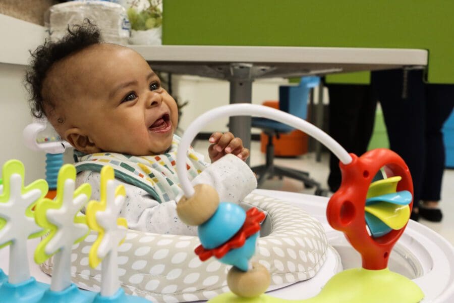 Micah Williams enjoys an activity chair in the student-family lounge at the Classroom Office Building on the Hammond campus.