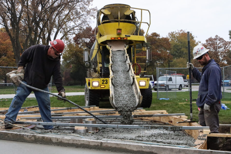 Cement is poured Nov. 9 for the new base of a bell tower on the Hammond campus.