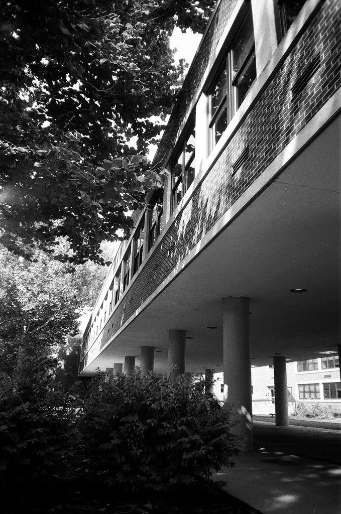 A black-and-white photo of a corridor.