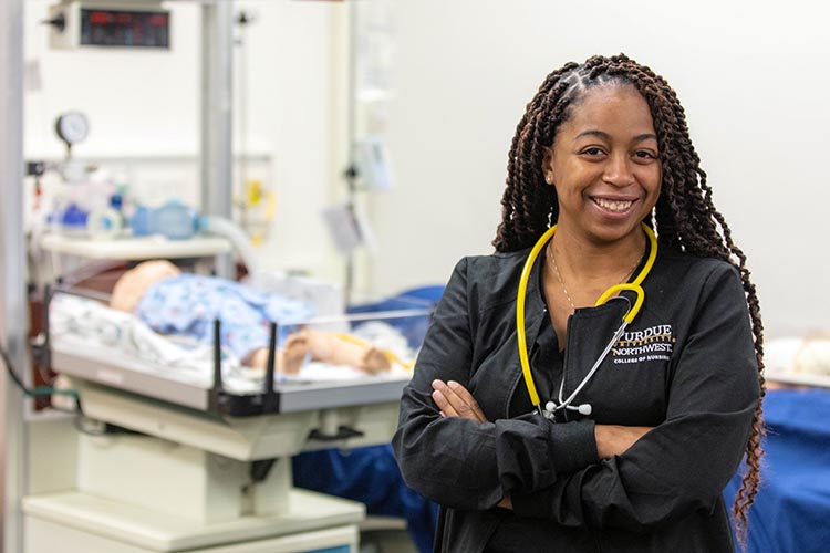 A Purdue University Northwest nursing student in a simulated care space.