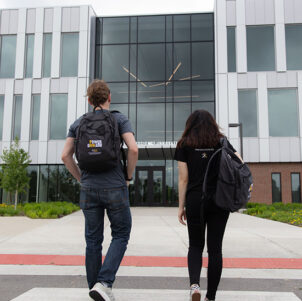 Students walk into the Nils K. Nelson Bioscience Innovation Building