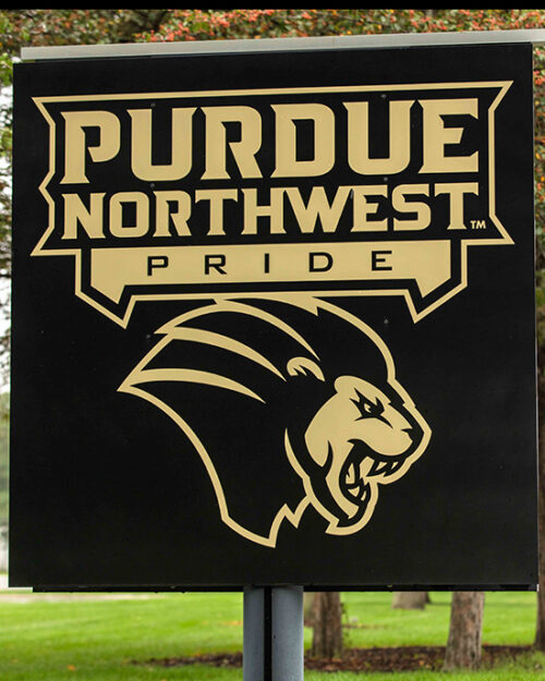 A sign with the athletics logo and Purdue Northwest Pride