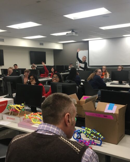 PNW associate professor of Biological Sciences Scott Bates, foreground, and assistant professor of Biological Sciences Lindsay Gielda, background, lead the “Protein Modeling” activity during the 2020 Regional Science Olympiad Tournament.