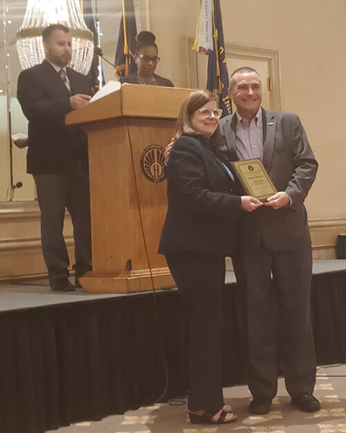 PNW Disability Access Center Director Debra Wysong accepts an award at at the City of Hammond Mayor's Commission on Disabilities 36th Annual Awards Breakfast