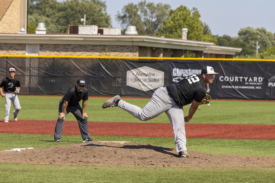 A PNW baseball player pitches on the mound
