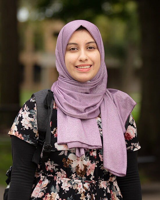 A PNW student in a hijab on campus