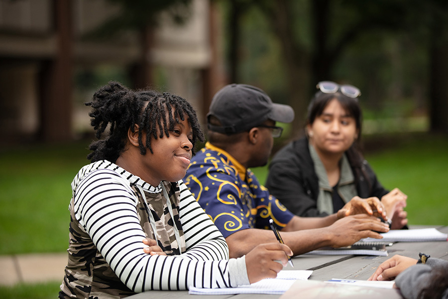 PNW students talk around a table