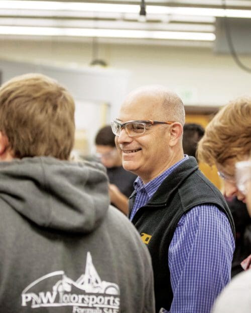 Jim Higley teaching a group of students